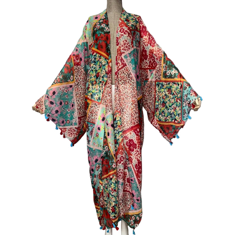 Colorful patterned kimono-style garment on a mannequin with WINYI branding.